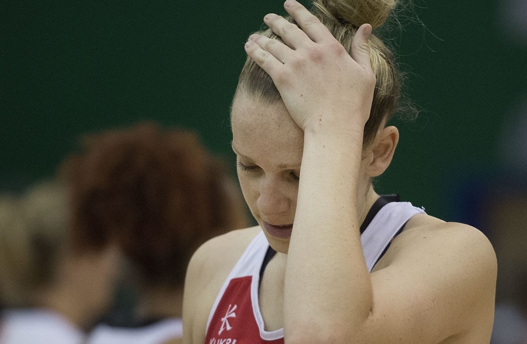 England's Jo Harten walks from the court dejected after their loss to the Silver Ferns in Palmerston North. October 2014.