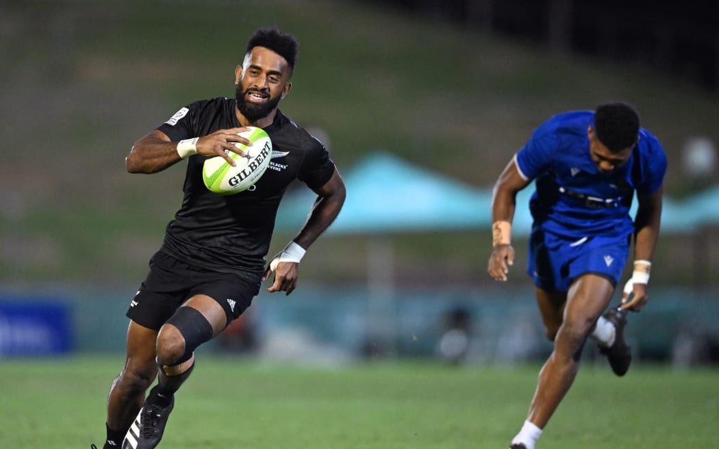 Akuila Rokolisoa of New Zealand gets past Motu Opetai of Samoa to score a try during the final of the 2023 Oceania Rugby Sevens Championship in Brisbane.