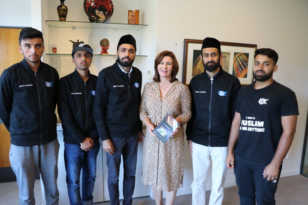 Mustenser Qamar (second to right) and his associates with Nelson mayor Rachel Reese, centre.