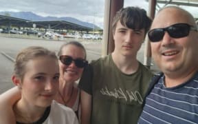 Mark Dodson, far right, with his daughter Kiara, wife Elisna and son James.