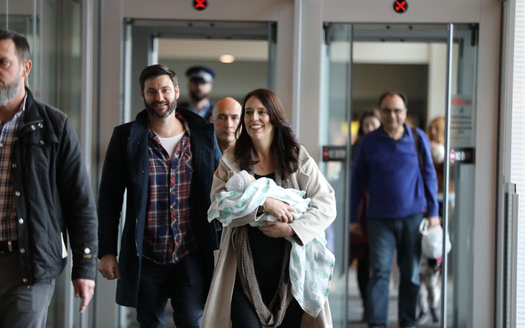 Jacinda Ardern arrives in Wellington with baby Neve and partner Clarke Gayford.