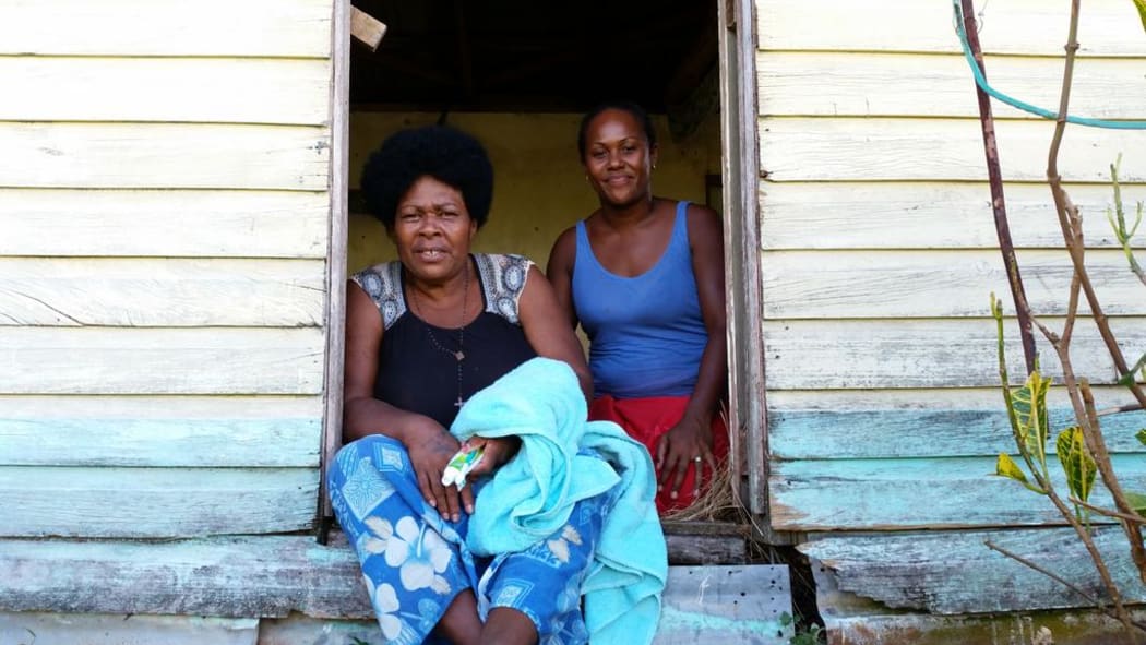 Two residents of Nadalei Village, in the remote interior of Fiji's Viti Levu Island. The village was hard hit by Cyclone Winston.