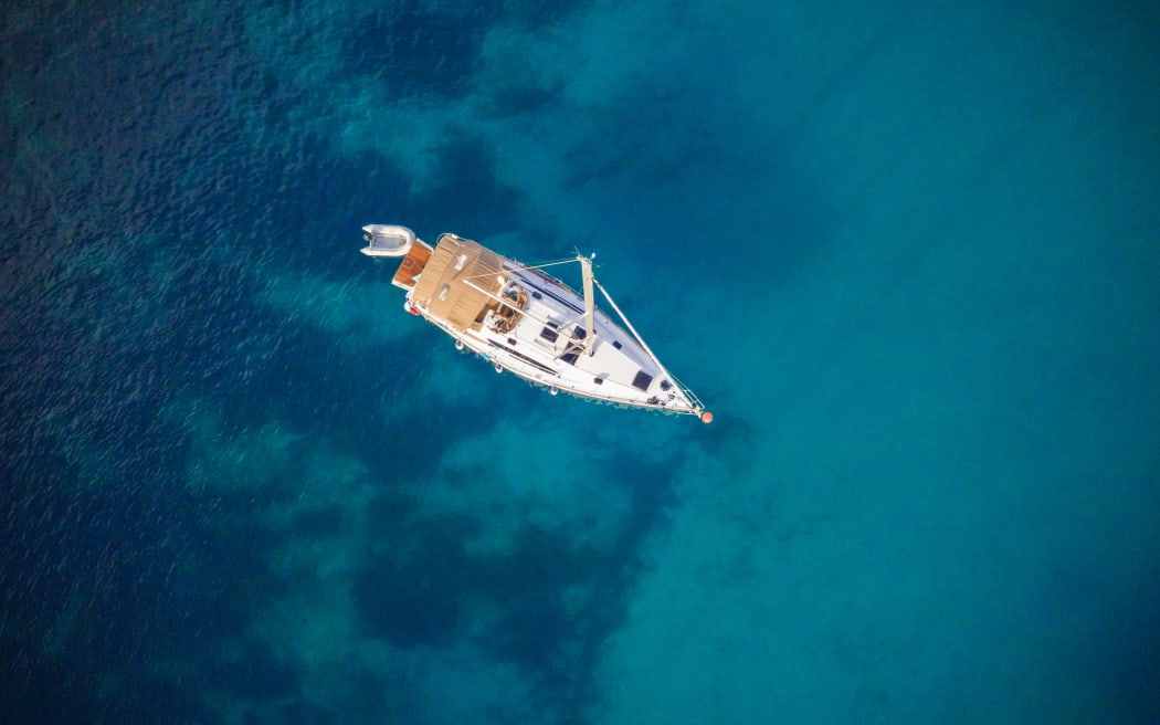 Aerial view of sailboat. Outdoor water sports, yachting.