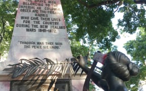 The war memorial on the corner of Symonds Street and City Road in Auckland. A The group have attached an axe to her head and a poster to the plaque that reads: “Fascism and White Supremacy are not Welcome Here.”