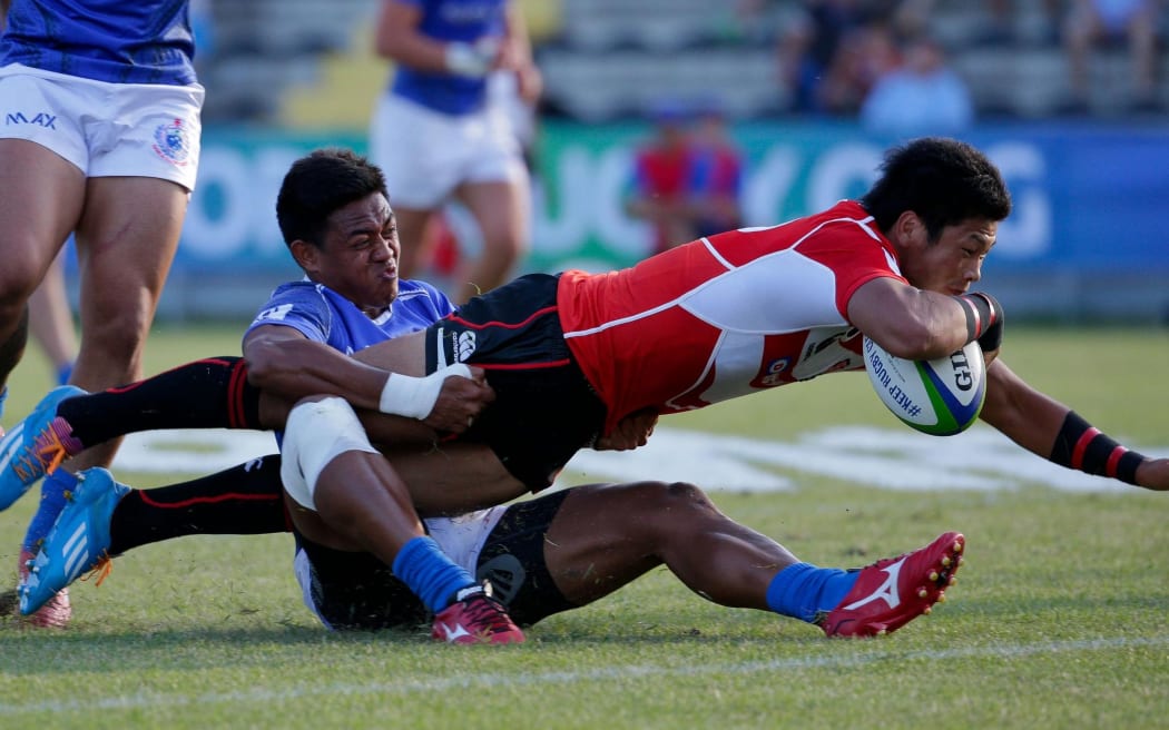 Full-back Ryuji Noguchi scores one of Japan's four tries in their win over Samoa.