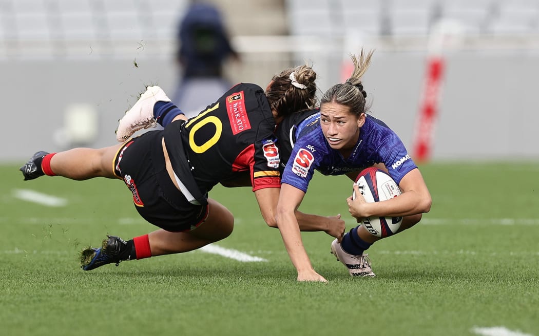 Jaymie Kolose of the Blues is tackled by Hazel Tubic of the Chiefs Manawa during the Super Rugby Aupiki Final rugby match between the Blues and the Chiefs Manawa at Eden Park in Auckland, New Zealand on Saturday, April 13, 2024. Photo: David Rowland / www.photosport.nz