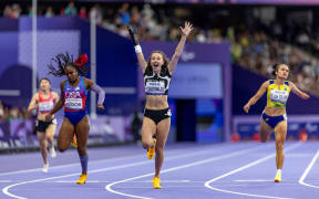 A handout picture taken and released by OIS/IOC on September 7, 2024 shows New Zealand's Anna Grimaldi celebrating her victory in the Para Athletics Women’s 200m - T47 Final at the Stade de France in Saint-Denis outdise Paris, during the Paris 2024 Paralympic Games.