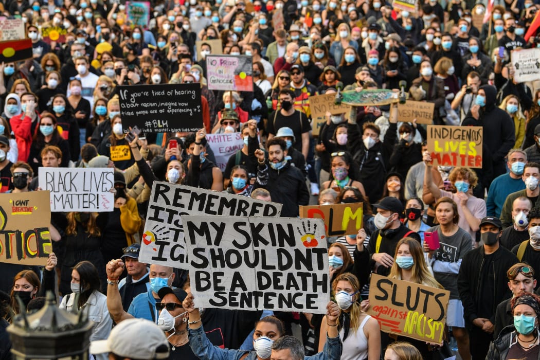 Demonstrators attend a Black Lives Matter protest to express solidarity with US protestors in Sydney on June 6, 2020 and demand an end to frequent Aboriginal deaths in custody in Australia.