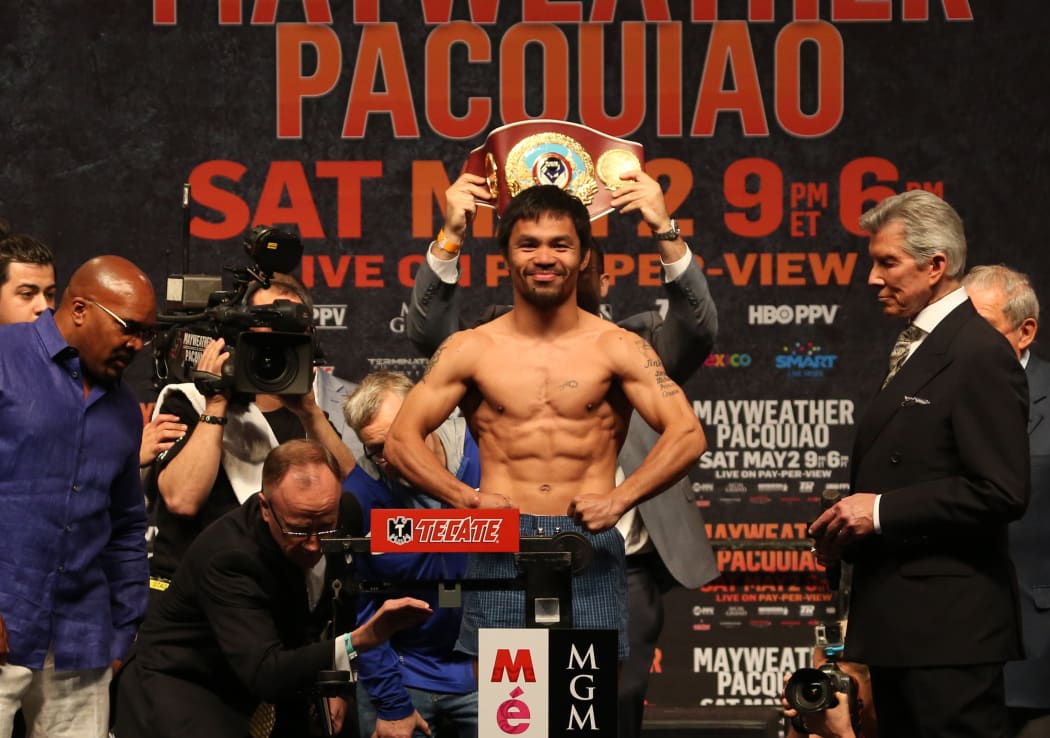 Boxer Manny Pacquiao weighs in for fight against Floyd Mayweather in 2015