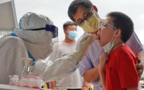 A child is tested for Covid-19 in China's Shandong Province.