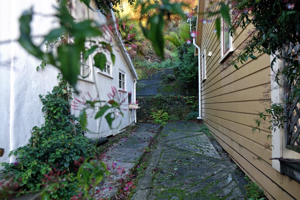 The property (left) suffered damage in a landslip.