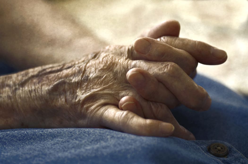 Old woman's hands clasped.