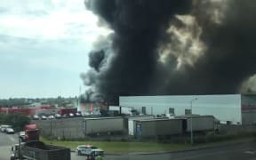 Eighty firefighters managed to stop the fire at freight company United Movers spreading to nearby buildings.