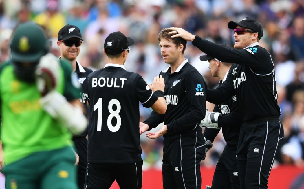 Lockie Ferguson and team mates celebrate the wciket of Faf du Plessis.