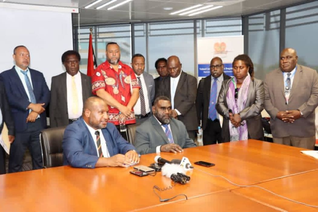 Seated: PNG Prime Minister James Marape and Bougainville's President Ishmael Toroama, with their delegations behind them, during talks in Port Moresby, 9 November 2020.