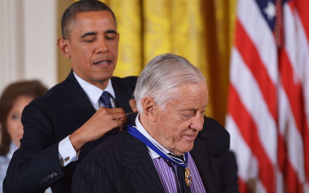 President Barack Obama presents the Presidential Medal of Freedom to former Washington Post executive editor Ben Bradlee in 2013.