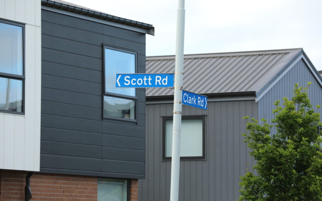 Scott Road street sign at the intersection of Clark & Scott Roads near where residents are upset about planned roadworks to close the only road in & out of the Scott Point Peninsula down to one lane while a road upgrade is completed by a developer.