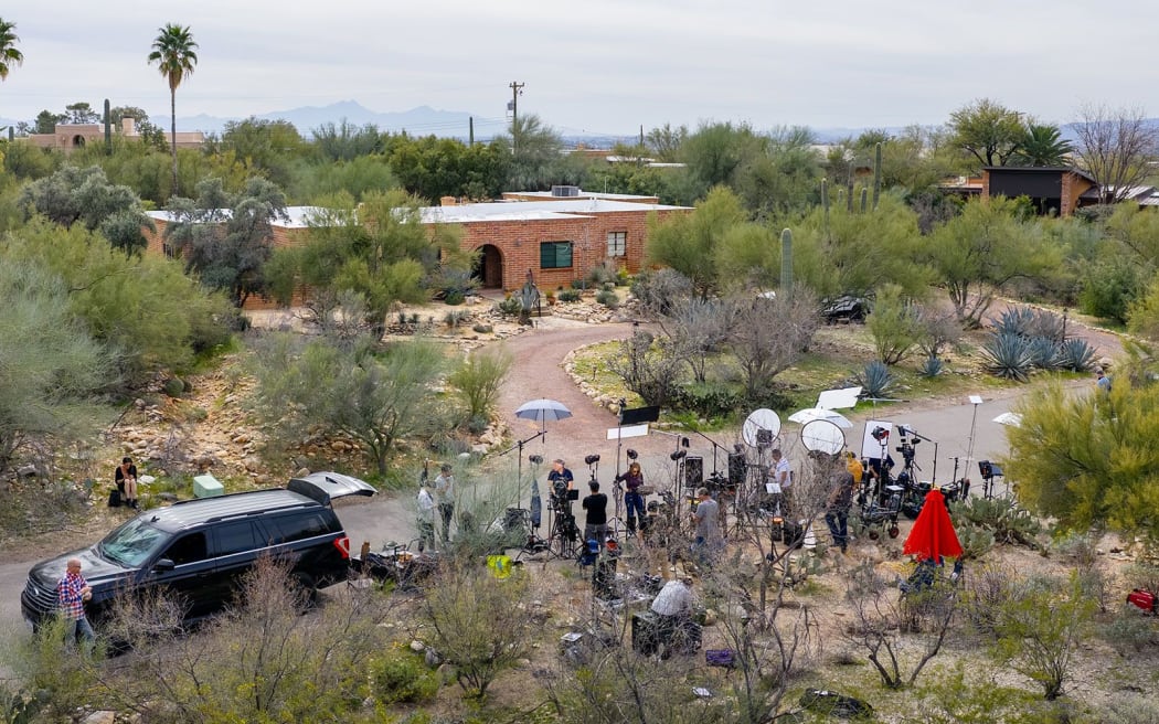 News crews gather outside Nancy Guthrie's home on Thursday, February 12.