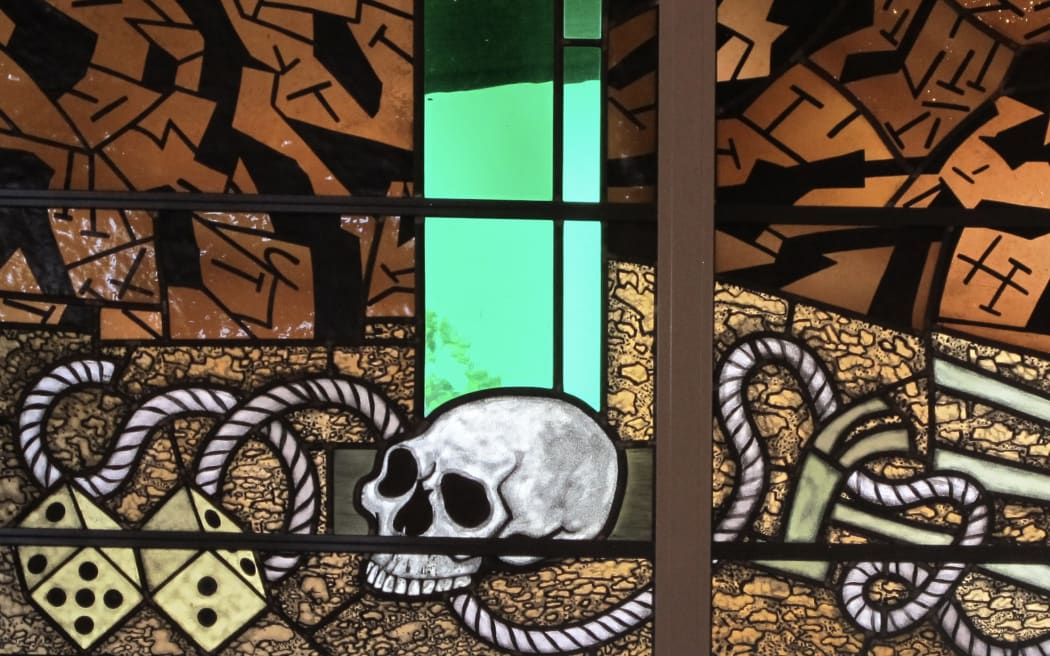 Detail of a skull in a graveyard designed by Robert Ellis