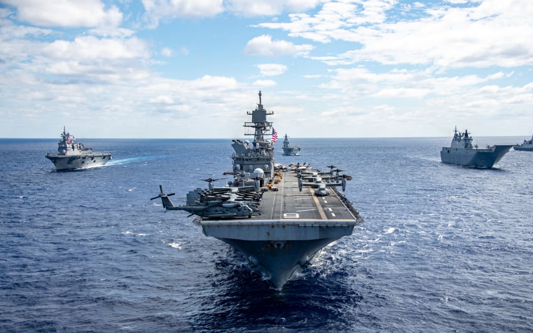 The forward-deployed amphibious assault ship USS America (LHA 6), flag ship of the America Strike Group, steams alongside U.S. Navy ships from the America Strike Group, Royal Australian Navy, Republic of Korea Navy, Royal New Zealand Navy, French Navy and Japan Maritime Self-Defense Force while in formation during a formation exercise as part of Talisman Sabre 25, July 20. Talisman Sabre is the largest bilateral military exercise between Australia and the United States advancing a free and open Indo-Pacific by strengthening relationships and interoperability among key allies and partners, while enhancing our collective capabilities to respond to a wide array of potential security concerns.