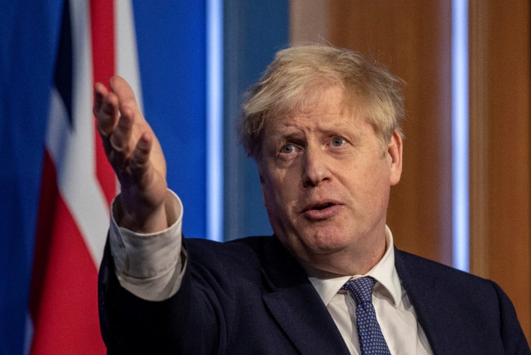 Britain's Prime Minister Boris Johnson speaks during a virtual press conference to update the nation on the status of the Covid-19 pandemic, in the Downing Street briefing room in central London on January 4, 2022.)
