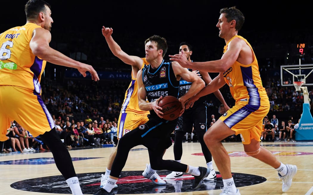 Breakers Tom Abercrombie surrounded by Sydney players.