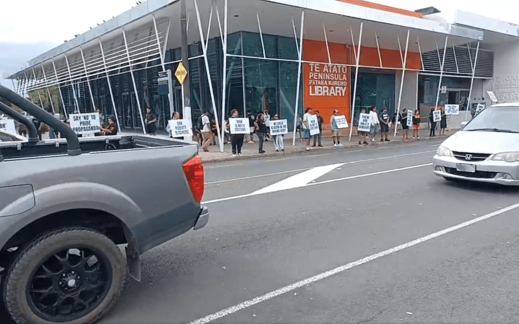 Members of the Destiny Church's "Man Up" group holding a protest outside Te Atatu library.