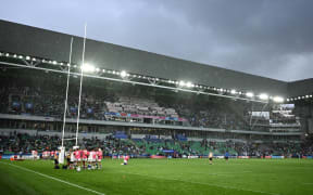 (FILES) Samoa's players warm up in the rain ahead of the France 2023 Rugby World Cup Pool D match between Argentina and Samoa at Stade Geoffroy-Guichard in Saint-Etienne, south-eastern France on September 22, 2023. French security services have arrested a Chechen man suspected of plotting an "Islamist-inspired" attack on a football game during the July-August Olympic Games, the interior ministry said on May 31, 2024. (Photo by Jeff PACHOUD / AFP)