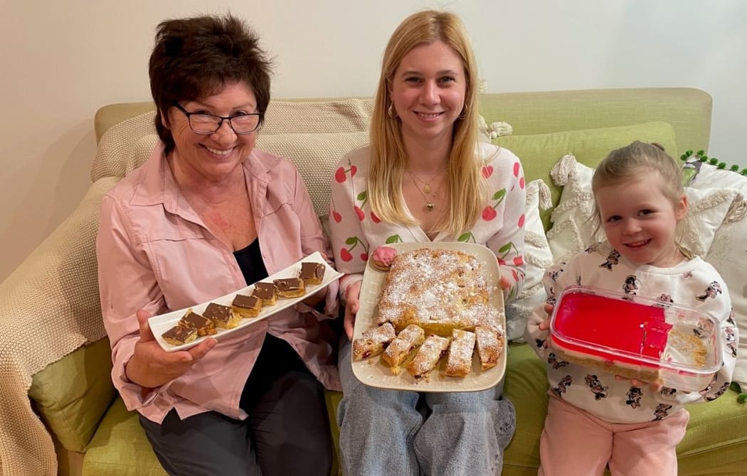 Lyubov Marchenko, left, Valeriya Horyayeva and Tereza Konyk show some of the treats that will be available at the Nelson Market bake sale to support Ohmatdyt Hospital in Kyiv.