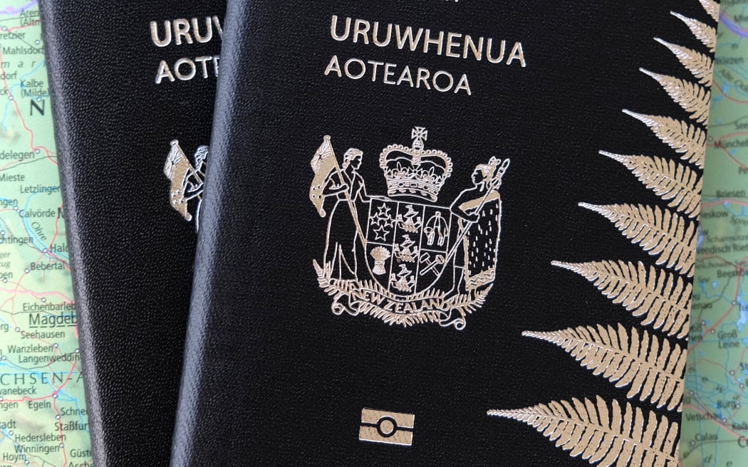 Two New Zealand passports against a map (file photo)