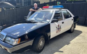 Stephen Parsons with the Mitsubishi V3000 he turned into a Ministry of Transport traffic cop car.