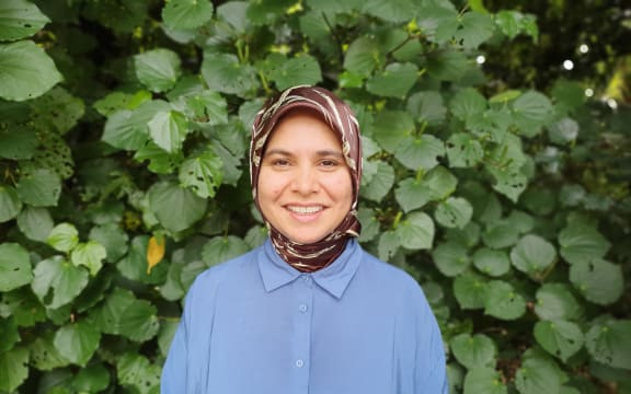 Image of Farha Ramzan standing in front of kawakawa.