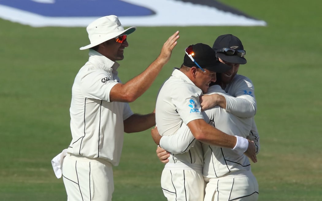 Ajaz Patel congratulated by team-mates.