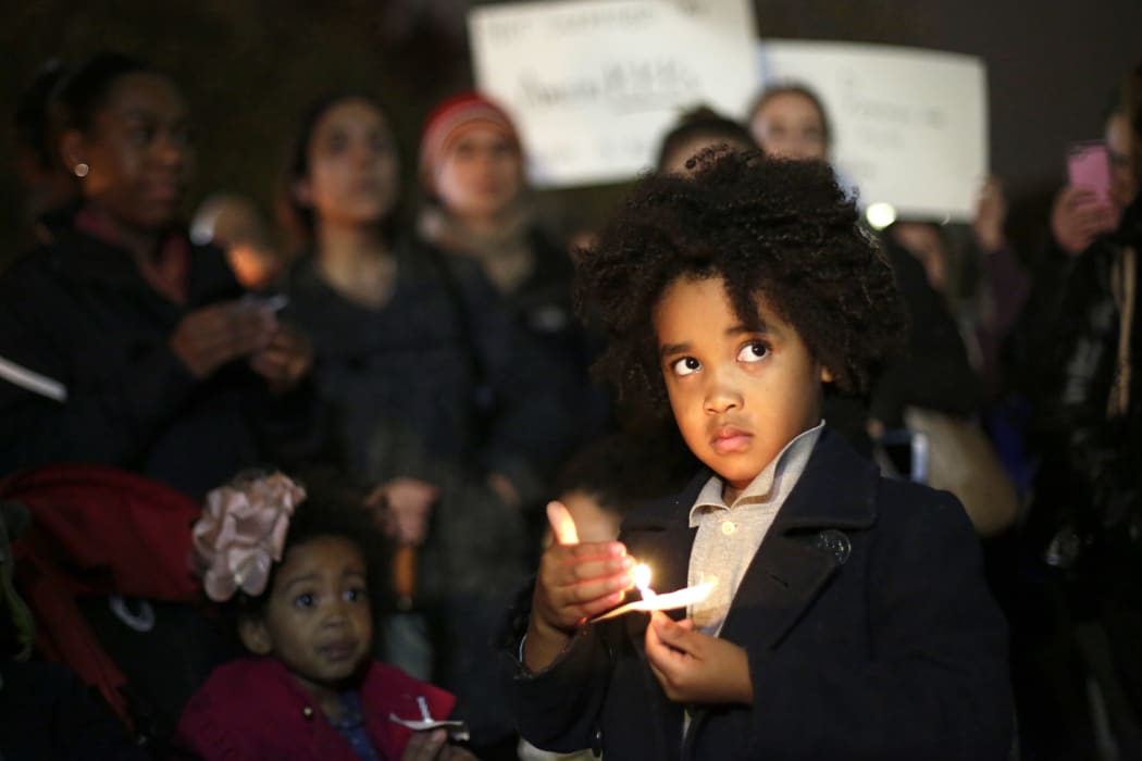 Protesters gather for a vigil outside the White House in Washington, DC on Wednesday night local time, after Donald Trump's presidential election victory.