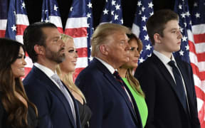 (FILES) (From R) Barron Trump, First Lady Melania Trump, US President Donald Trump, Tiffany Trump, Donald Trump Jr., and  Kimberly Guilfoyle stand after the president delivered his acceptance speech for the Republican Party nomination for reelection during the final day of the Republican National Convention at the South Lawn of the White House in Washington, DC on August 27, 2020. The US Republican Party has named Donald Trump's 18 year-old son Barron as a Florida delegate to its national convention, propelling another member of the family into the spotlight. (Photo by SAUL LOEB / AFP)