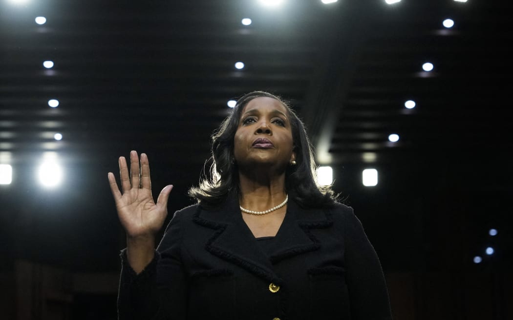(FILES) Lisa Cook, nominee to be a member of the Board of Governors of the Federal Reserve System, is sworn in during a Senate Banking nominations hearing on June 21, 2023 in Washington, DC. US Federal Reserve Governor Lisa Cook filed a lawsuit on August 28, 2025, to challenge Donald Trump's move to fire her -- as the president intensified pressure on the independent central bank.  Cook also asked for a temporary restraining order declaring that Trump's attempt to fire her is unlawful and preventing the Fed from removing her for now. A hearing on that motion has been set for August 29. Trump had published a letter on his Truth Social platform on August 25, stating that he was removing Cook from her role and citing accusations of false statements on her mortgage agreements. (Photo by Drew ANGERER / GETTY IMAGES NORTH AMERICA / AFP)