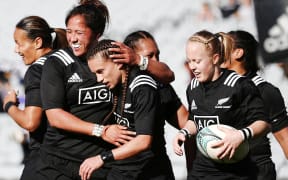 Selica Winiata (c) celebrates with teammates.