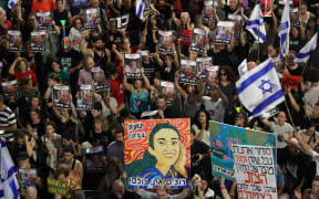 Relatives and supporters of Israelis taken hostage by Palestinian militants in Gaza in the October 7 attacks, demonstrate calling for their release in the central city of Tel Aviv on June 8, 2024, amid the ongoing conflict in the Gaza Strip between Israel and the Palestinian militant Hamas group. (Photo by GIL COHEN-MAGEN / AFP)