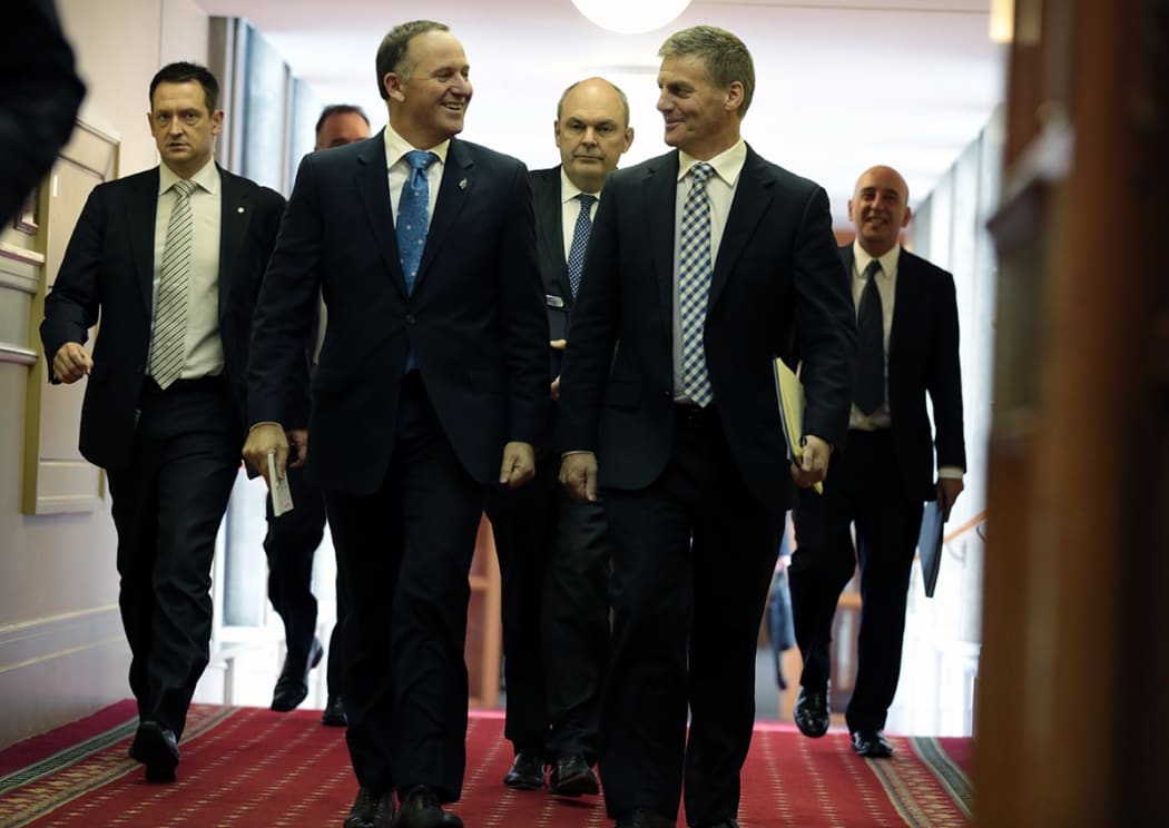 John Key and Bill English walk towards the debating chamber at Parliament.