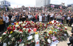 Belarus opposition supporters gather near the Pushkinskaya metro station where Alexander Taraikovsky, a 34-year-old protester died on August 10, during their protest rally in central Minsk, Belarus.