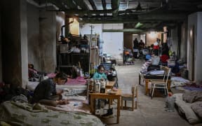 Children being treated at a pediatrics hospital have their beds placed in the basement of the hospital which is being used as a bomb shelter, in Kyiv on February 28, 2022.