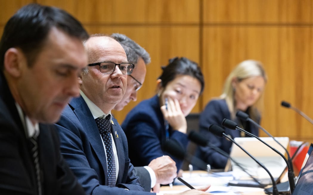 ACT MP Todd Stephenson listens to evidence in select committee.