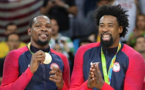 Kevin Durant and DeAndre Jordan from USA basketball team show off their gold medals at Rio Olympics