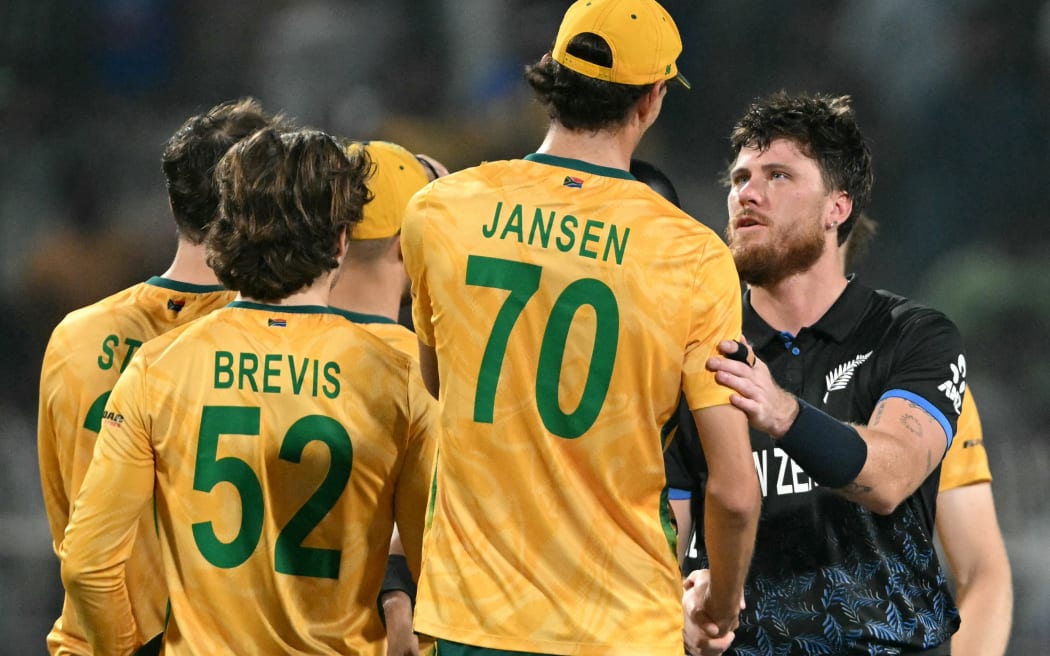 South Africa's Marco Jansen congratulates New Zealand's Finn Allen after the Black Caps' win in their T20 World Cup semifinal in Kolkata,  March 4, 2026. (Photo by Dibyangshu SARKAR / AFP)