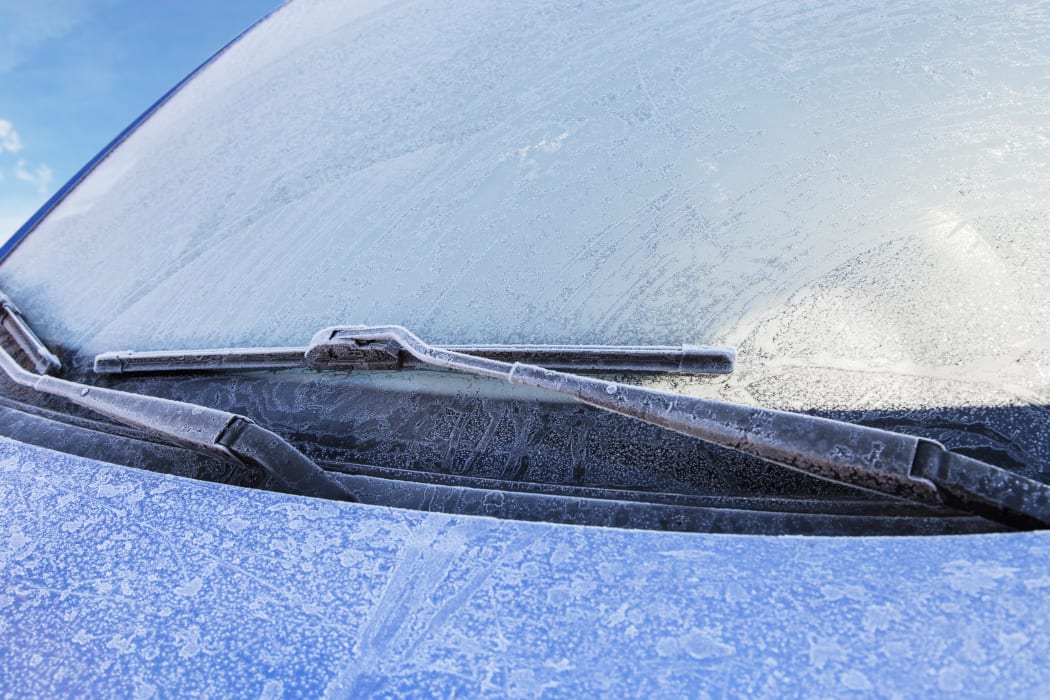 Frost covers a car's windshield on a cold winter morning (file photo)