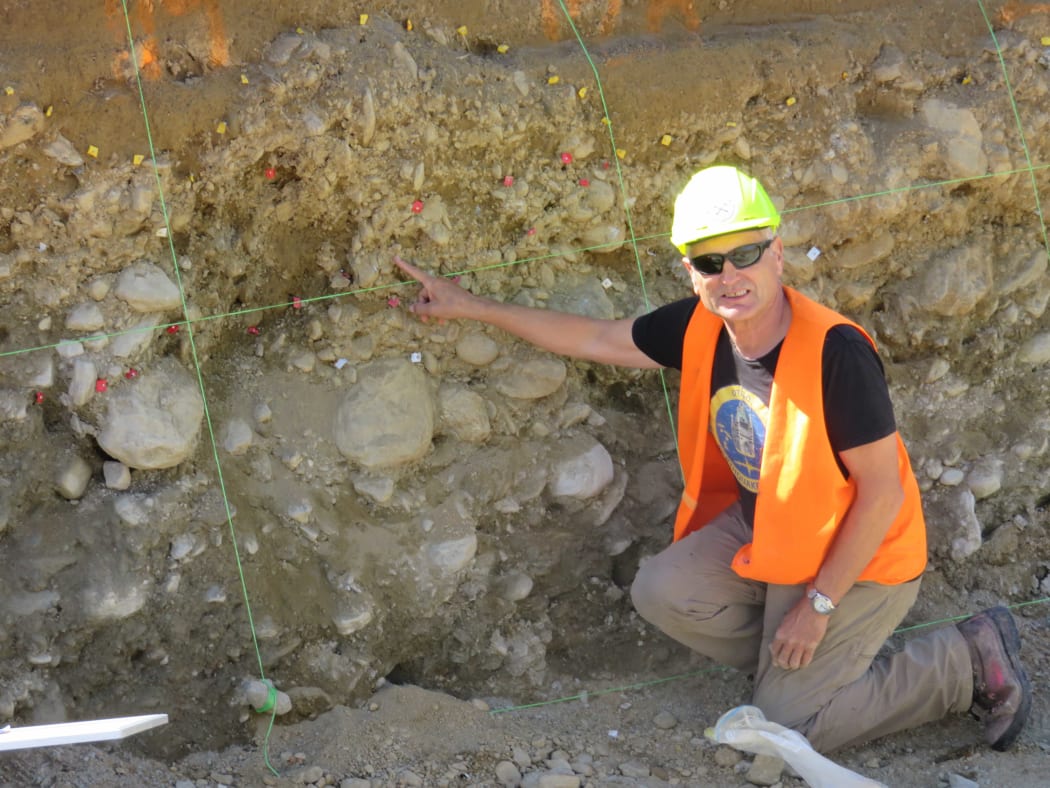 Professor Mark Stirling checking out the soil layers at their field work in West Otago.