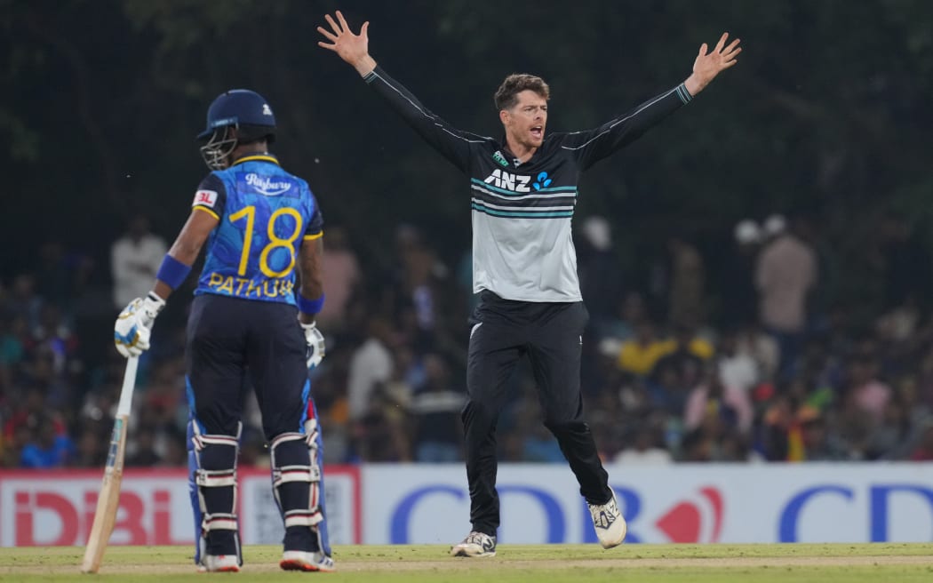 Mitchell Santner celebrates a wicket against Sri Lanka.