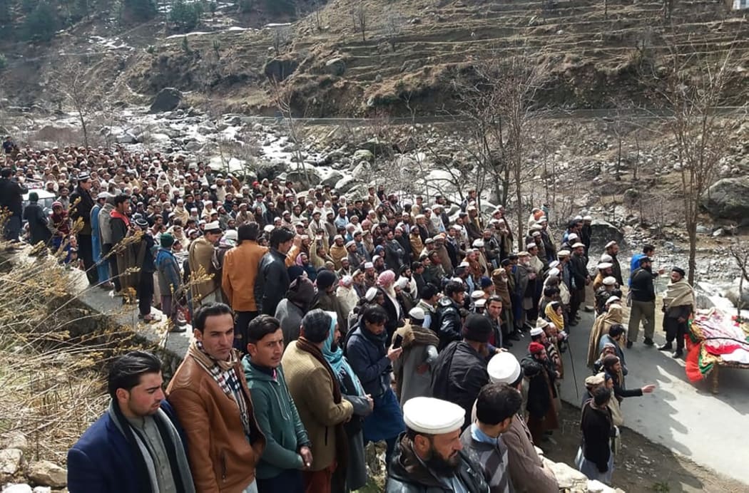 Pakistani residents offer funeral prayers beside the coffin of Afzal Kohistani, who was killed by gunmen, in Battagram District in Khyber Pakhtunkhwa Province.