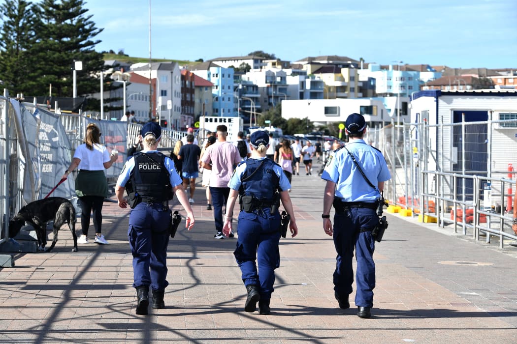 Police patrol near Bondi Beach in Sydney after an extension of the lockdown was announced yesterday.