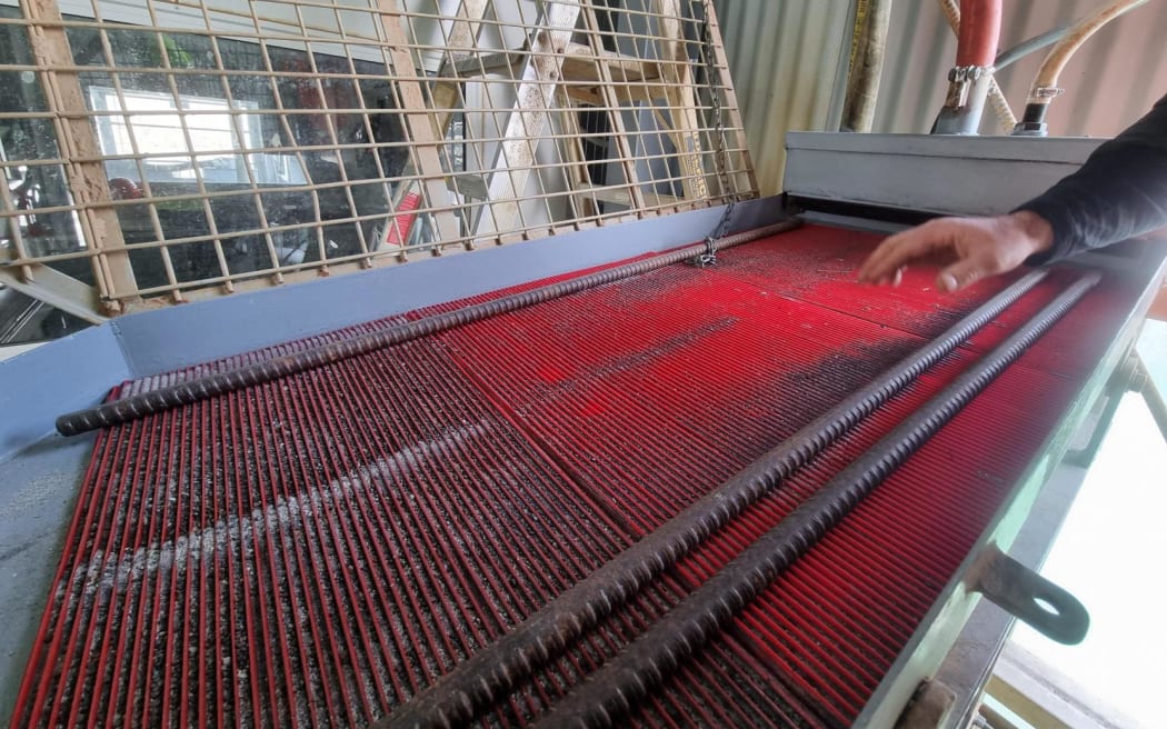 A vibrating platform that has 36 millimetre holes to help sift through the gravel at Millers Flat gold mine.